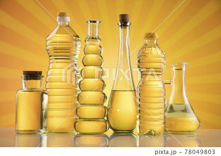 Olive oil bottles, olive branch and Cooking oils 78049803