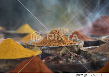 Wooden table of colorful spices Wooden table of colorful spices 78050402