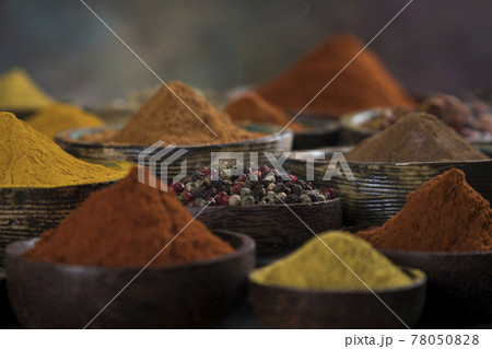 Spices on wooden bowl background 78050828