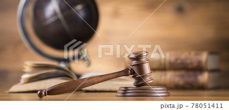 Law and justice concept, wooden gavel, globe background Law and justice concept, wooden gavel, globe background 78051411