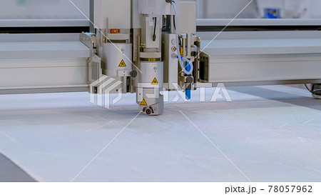 Digital cutting system - flatbed cutter, router during work at exhibition Digital cutting system - flatbed cutter, router during work at exhibition 78057962