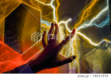 Woman hand touching plasma panel display in dark room of museum - close up view Woman hand touching plasma panel display in dark room of museum - close up view 78057976