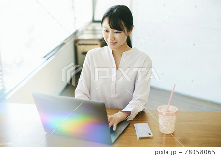 A woman working at home A woman working at home 78058065