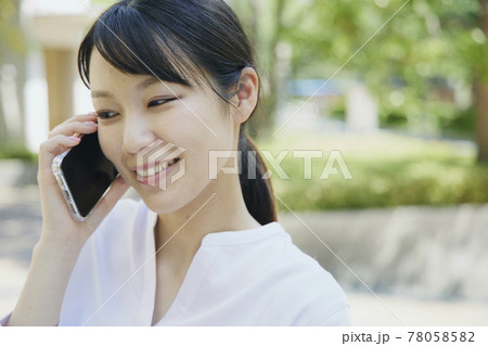 Woman with cell phone, city. Woman with cell phone, city. 78058582