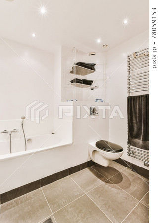 Light bathroom with wooden rack and sink table 78059153