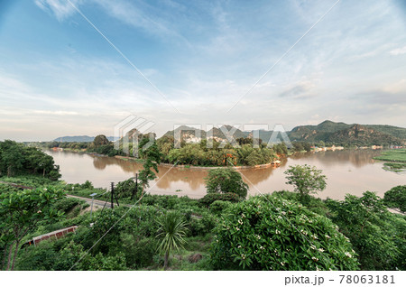 Scenery of tropical rainforest and historic railway on River Kwai in the evening at Kanchanaburi, Thailand 78063181