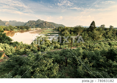 Scenery of tropical rainforest and historic railway on River Kwai in the evening at Kanchanaburi, Thailand 78063182