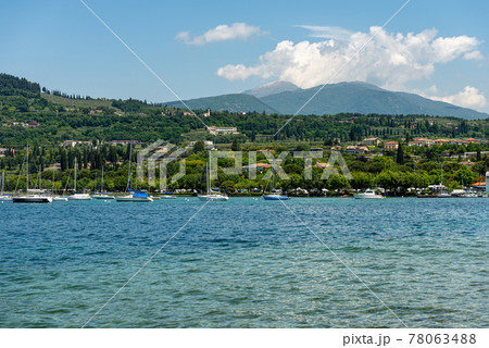 Coast of Lake Garda in front of the small village of Bardolino - Veneto Italy 78063488