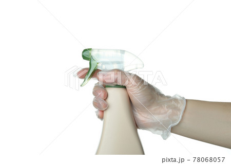 Female hand in disposable glove hold sprayer, isolated on white background 78068057