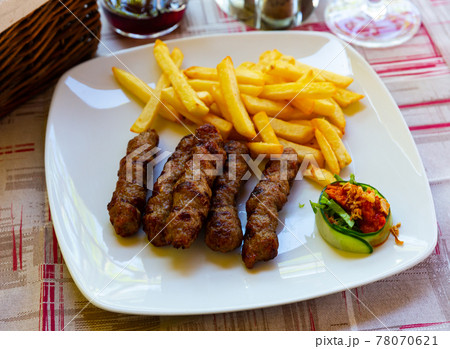 Grilled dish of minced meat Cevapcici 78070621