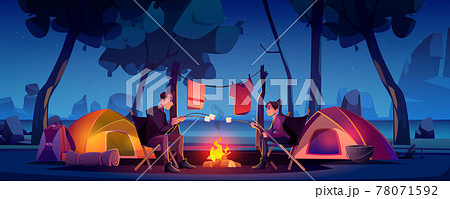 Couple in camp with tent and campfire at night 78071592