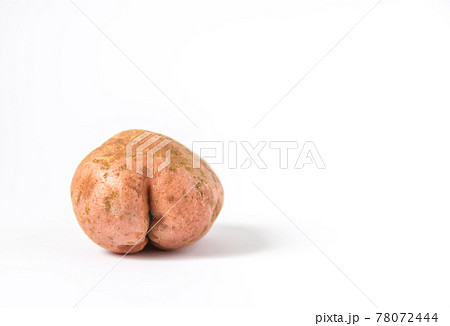 Raw funny potato in a shape of ass. Raw funny potato in a shape of ass. 78072444