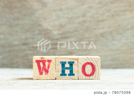 Alphabet letter block in word who on wood background Alphabet letter block in word who on wood background 78075098