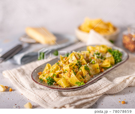 Garlic pasta with chilli flakes 78078659