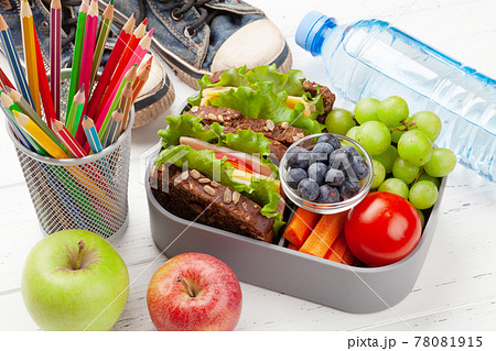 Healthy school lunch box with sandwich and fresh vegetables Healthy school lunch box with sandwich and fresh vegetables 78081915