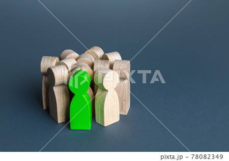 A green man stands in a crowd of people. Recruiting a talented candidate. Search for a person. Promising. Different from others. Be special. Valuable employee. Promotion at work, career growth A green man stands in a crowd of people. Recruiting a talented candidate. Search for a person. Promising. Different from others. Be special. Valuable employee. Promotion at work, career growth 78082349