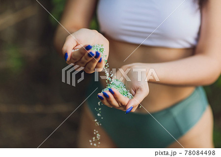 Tiny pieces of plastic collected from sandy beach in hands of environmentalist. Microplastic is polluting the sea and marine ecosystem. Tiny pieces of plastic collected from sandy beach in hands of environmentalist. Microplastic is polluting the sea and marine ecosystem. 78084498