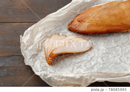 Smoked chicken breast on brown wooden board Smoked chicken breast on brown wooden board 78085995