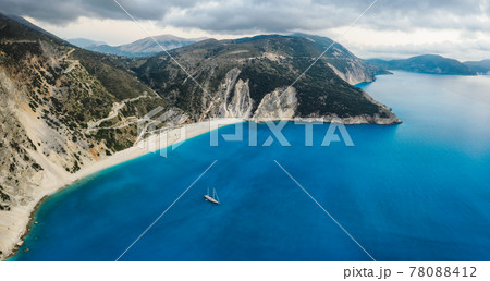 Luxury Sail Yacht in Myrtos beach with blue bay on Kefalonia Island, Greece. Aerial panoramic photo Luxury Sail Yacht in Myrtos beach with blue bay on Kefalonia Island, Greece. Aerial panoramic photo 78088412