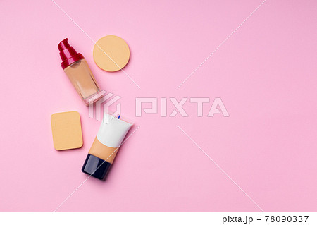 Make up foundation pack on pink background Make up foundation pack on pink background 78090337