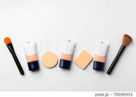 Make up liquid foundation with brush on white background 78090953