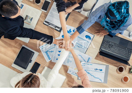 Teamwork business people join hands in meeting. Teamwork business people join hands in meeting. 78091900