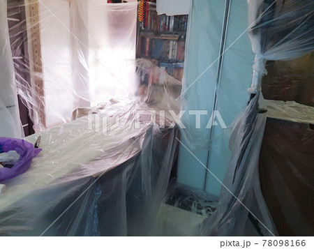 Room ready for renovation covered with plastic wrap. Plastic sheet. Room ready for renovation covered with plastic wrap. Plastic sheet. 78098166