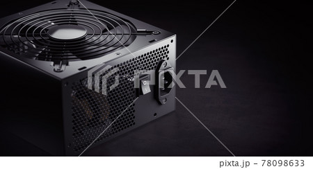 Computer AC power supply unit on black background. Computer AC power supply unit on black background. 78098633