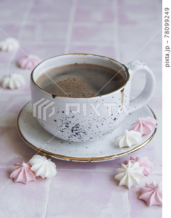 Cup with coffee and small meringues Cup with coffee and small meringues 78099249