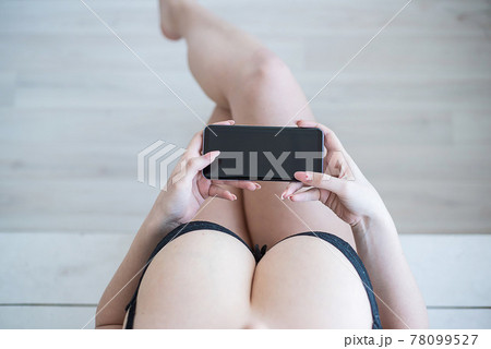 European Girl With Huge Natural Breasts Holding A Smartphone, Top