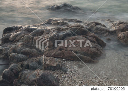 stones by the sea. waves of the sea from long exposure. 78100903
