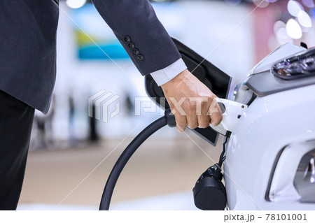 Hand holding Electric car charger.  78101001