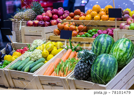 Fresh fruits at a market. Fruit stall in the city market. Fruits in baskets on market place. Fresh fruits at a market. Fruit stall in the city market. Fruits in baskets on market place. 78101479