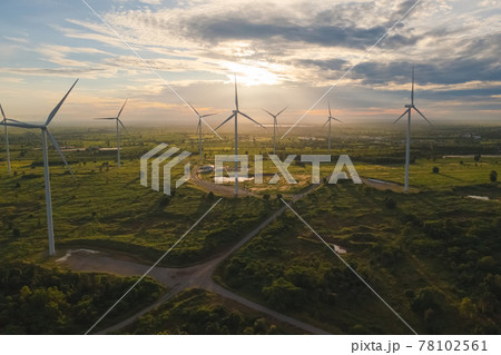 Aerial view of wind turbines or windmills farm field in industry factory. Power, sustainable green clean energy, and environment concept. Nature innovation. Aerial view of wind turbines or windmills farm field in industry factory. Power, sustainable green clean energy, and environment concept. Nature innovation. 78102561