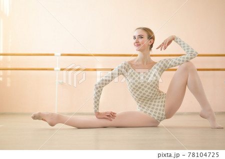 Graceful hyper-flexible ballerina is training in a dance class with ballet machines. 78104725