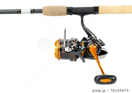 The fishing reel is mounted on a fishing rod for catching bream, carp, roach. 78104974