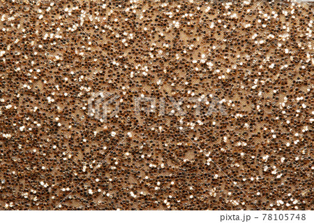 キラキラしたラメが散りばめられた茶色い背景 78105748