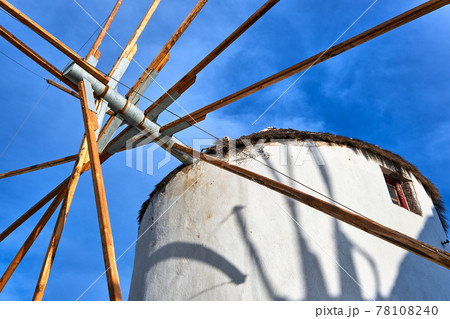 Famous tourist attraction of Mykonos, Greece. Traditional whitewashed windmill at clear blue sky. Summer, travel destination, upshot. 78108240
