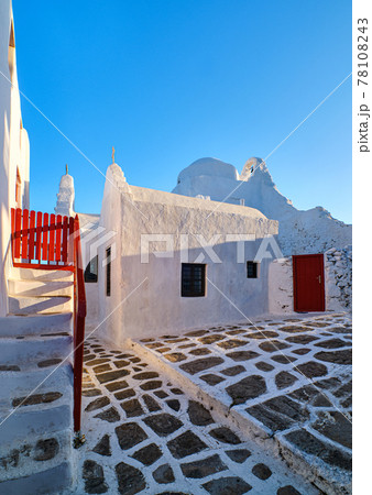 Backyard of main tourist landmark, Mykonos, Greece, white Greek Orthodox church of Panagia Paraportiani, at sunrise. Iconic destination Backyard of main tourist landmark, Mykonos, Greece, white Greek Orthodox church of Panagia Paraportiani, at sunrise. Iconic destination 78108243