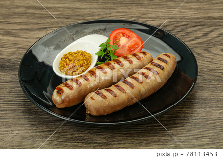Grilled natural pork sausages with sauce Grilled natural pork sausages with sauce 78113453