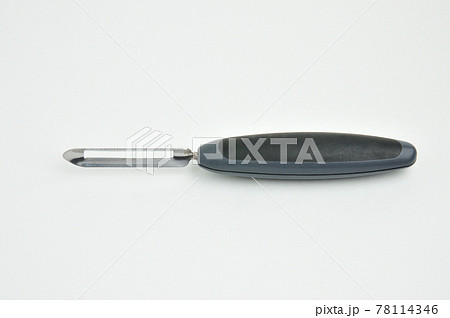 Fruit and vegetable scraper on a white background Fruit and vegetable scraper on a white background 78114346