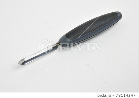 Fruit and vegetable scraper on a white background Fruit and vegetable scraper on a white background 78114347
