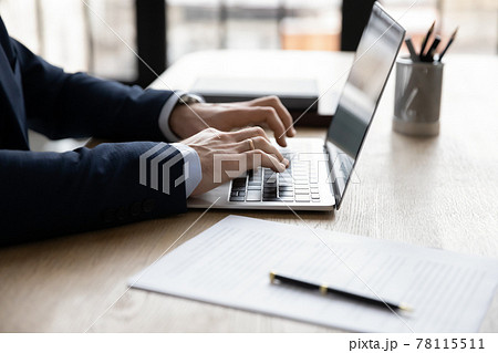 Hands of businessman using app laptop at workplace Hands of businessman using app laptop at workplace 78115511