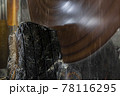 Large industrial cutting machine cuts gray granite stone into slabs 78116295