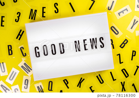 Lightbox with message GOOD NEWS on yellow background with black letters around 78116300
