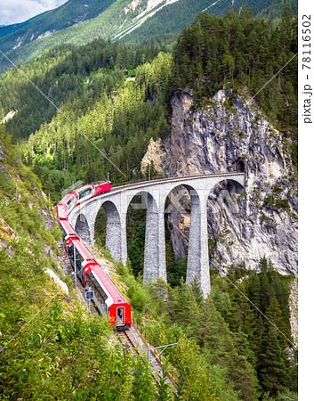 Rhaetian express moves on Landwasser Viaduct, Switzerland Rhaetian express moves on Landwasser Viaduct, Switzerland 78116502