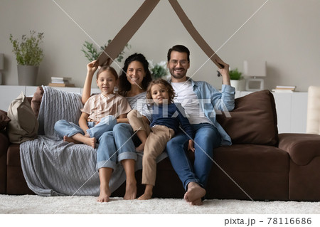 Portrait of happy family with kids in new home 78116686