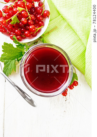 Jam of red currant in jar on light board top Jam of red currant in jar on light board top 78124400