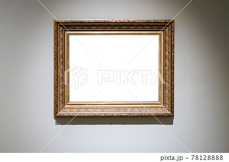 old carved wide wooden picture frame on gray wall old carved wide wooden picture frame on gray wall 78128888