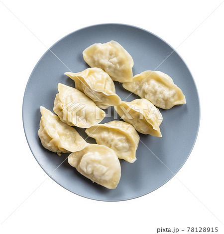 top view of several boiled dumplings on gray plate 78128915
